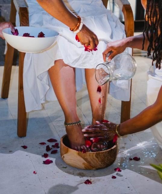 A foot washing ritual with rose petals