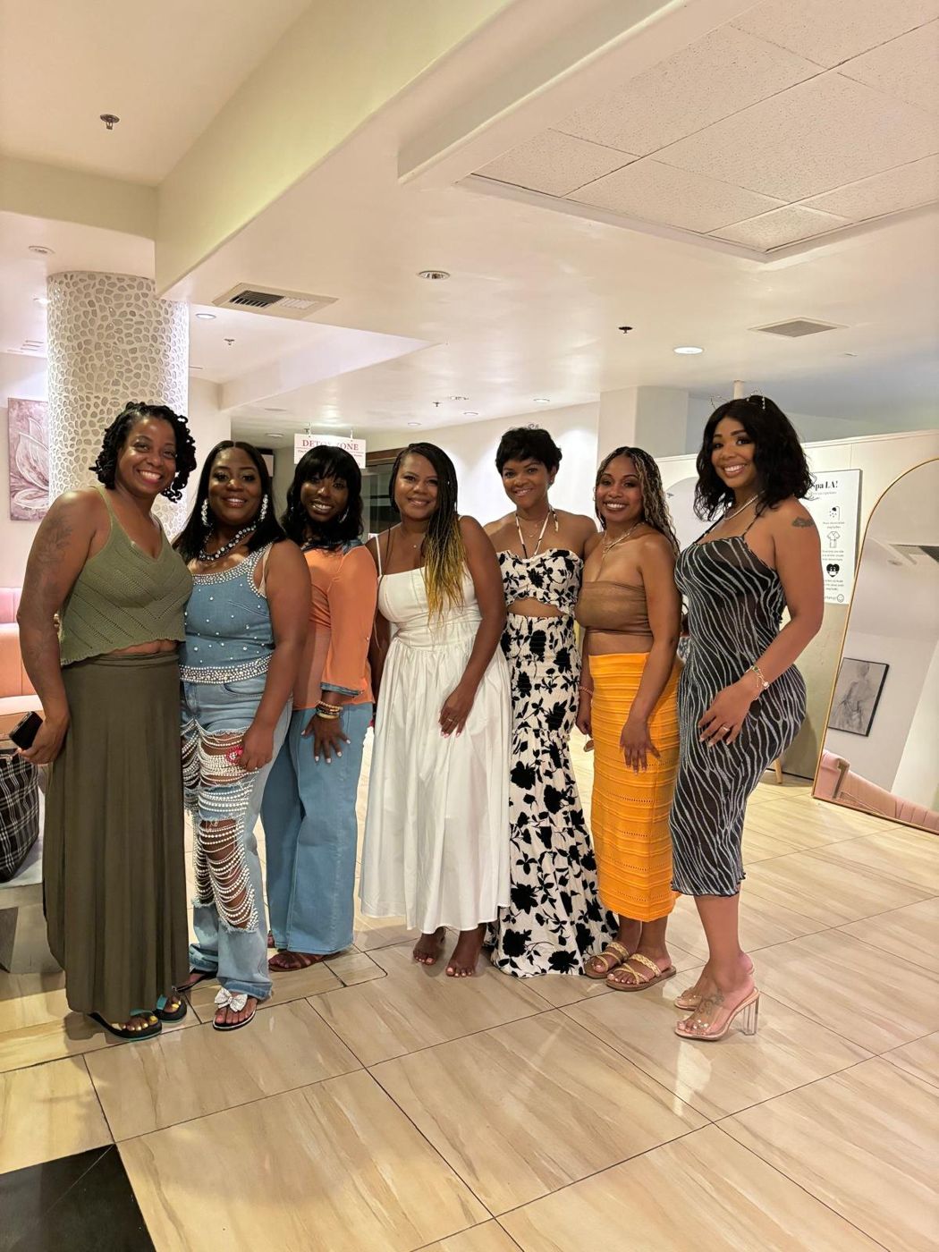 Women standing together in a bright room